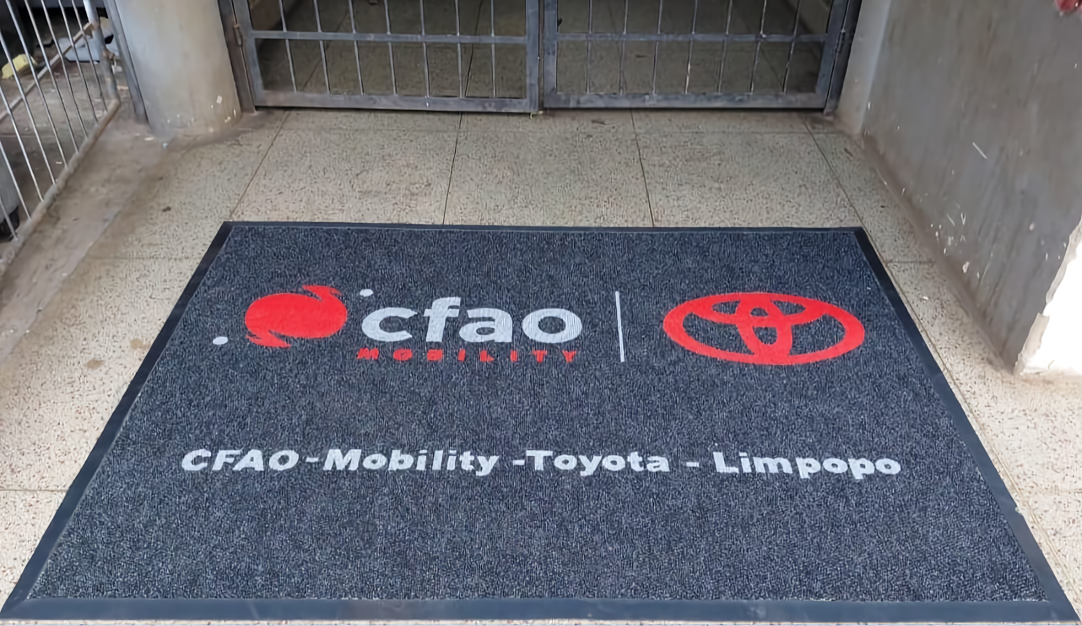 Dealership entrance mat with dealer branding