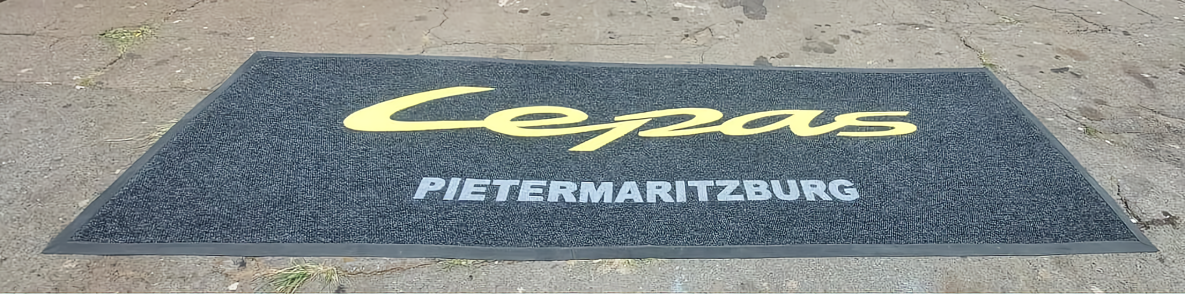 Custom logo entrance mat for a motor dealership showroom