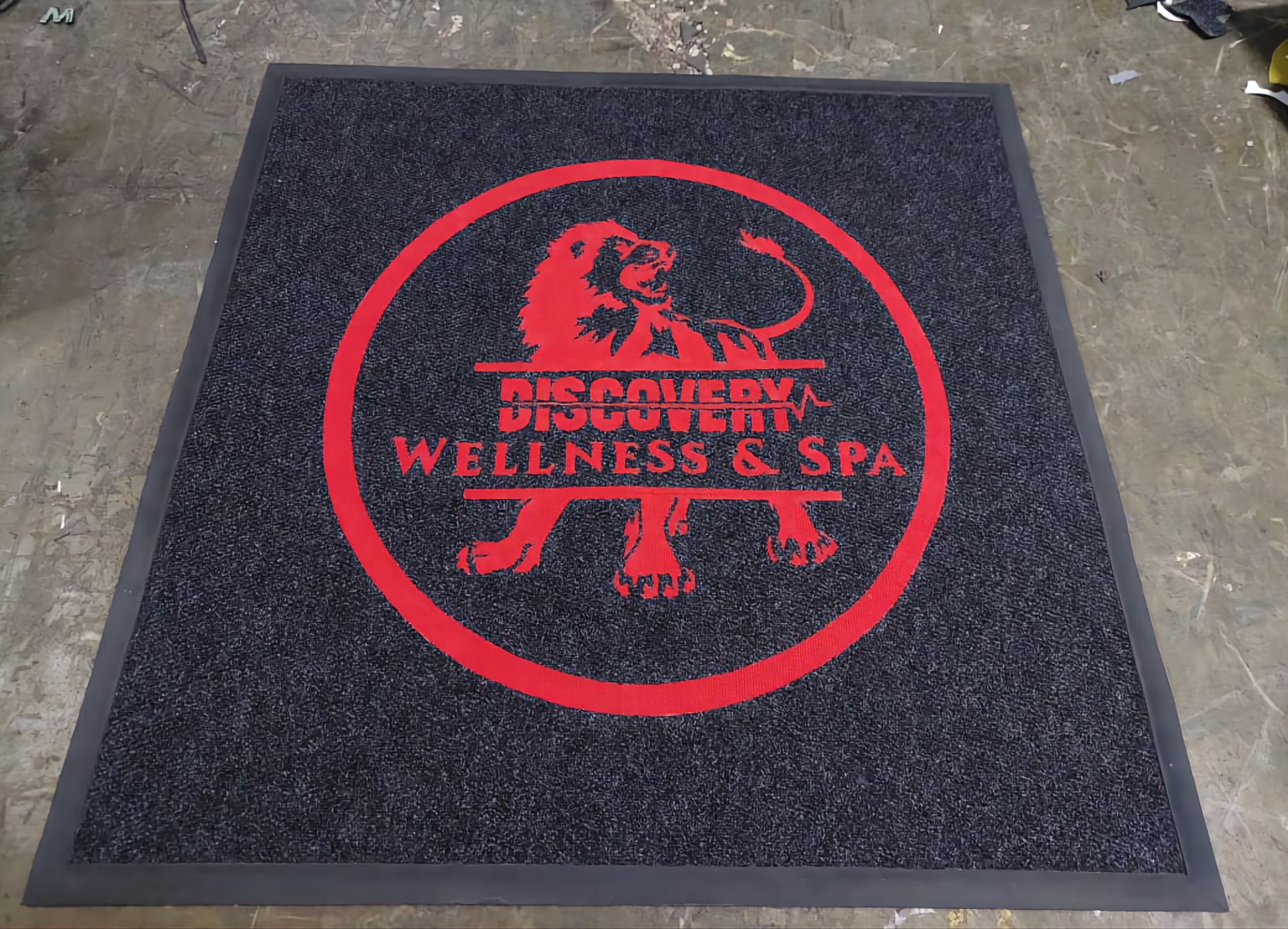 Logo door mat for a motorcycle dealership entrance