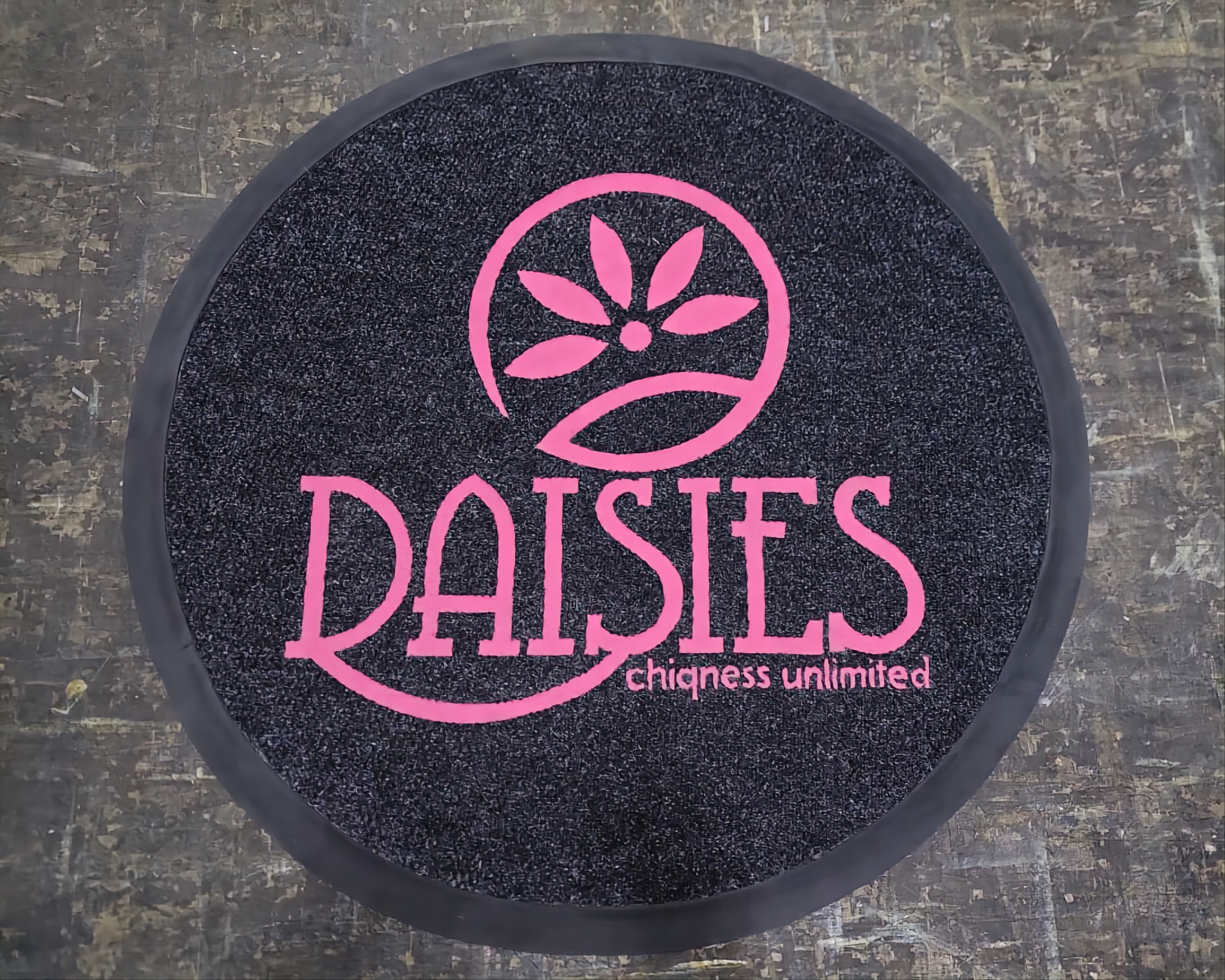 Logo door mat for a boutique retail entrance