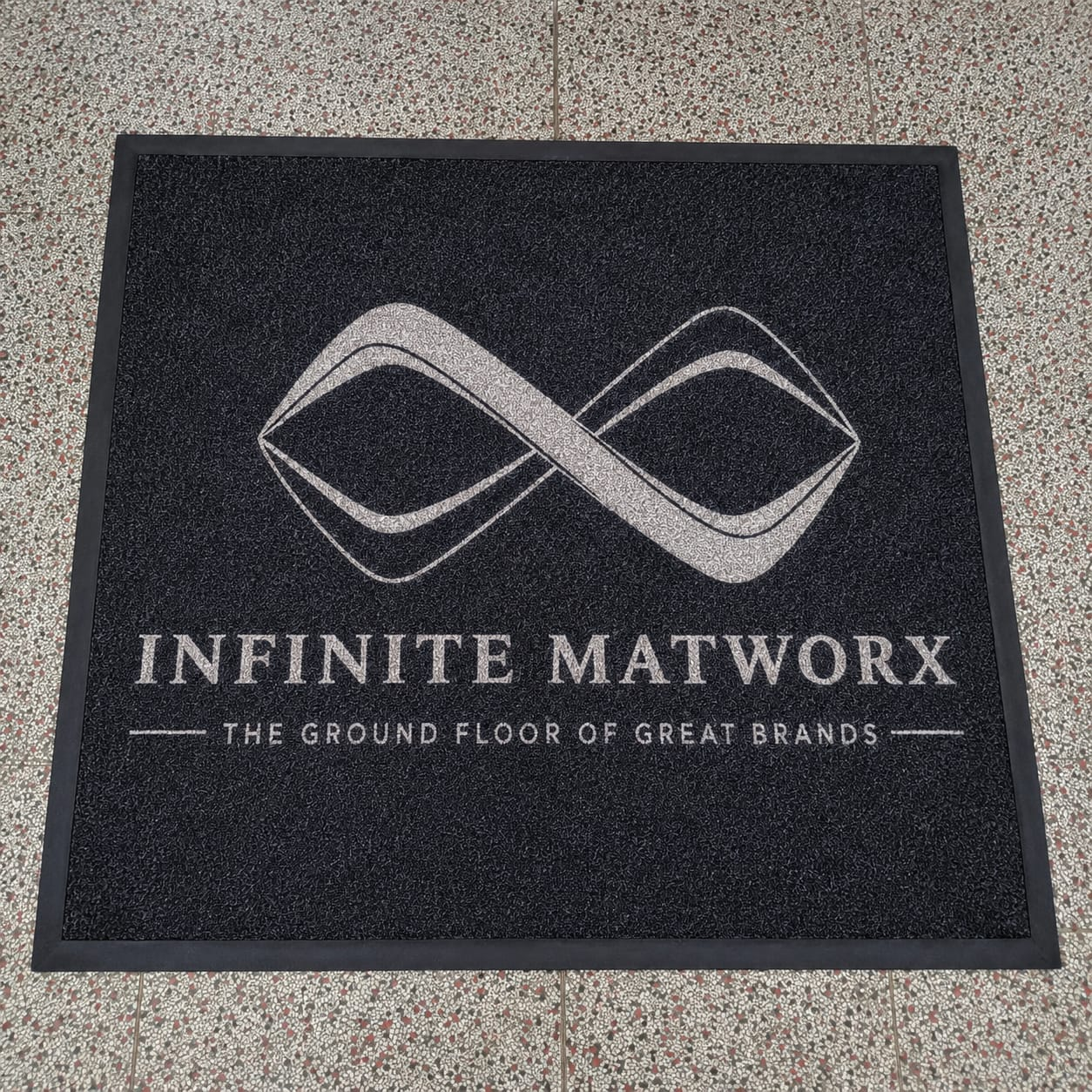 Craftsmanship of a custom branded entrance mat manufactured by Infinite Matworx